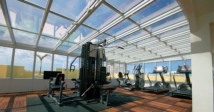 Gym with glass ceiling and glass walls