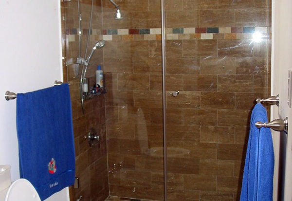 Clear glass door separation for toilet and shower area